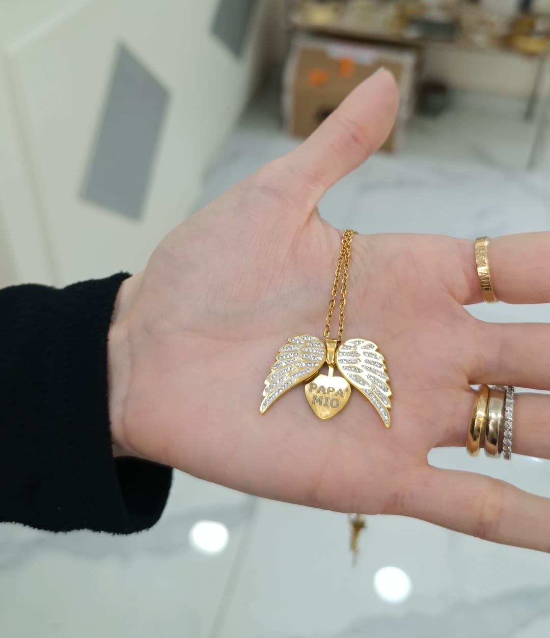 COLLANA CON ALI E CUORE IN ACCIAIO