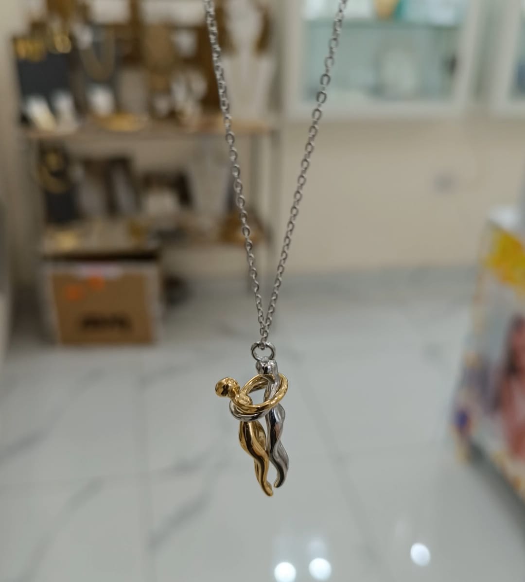 COLLANA ABBRACCIO LUI E LEI IN ACCIAIO